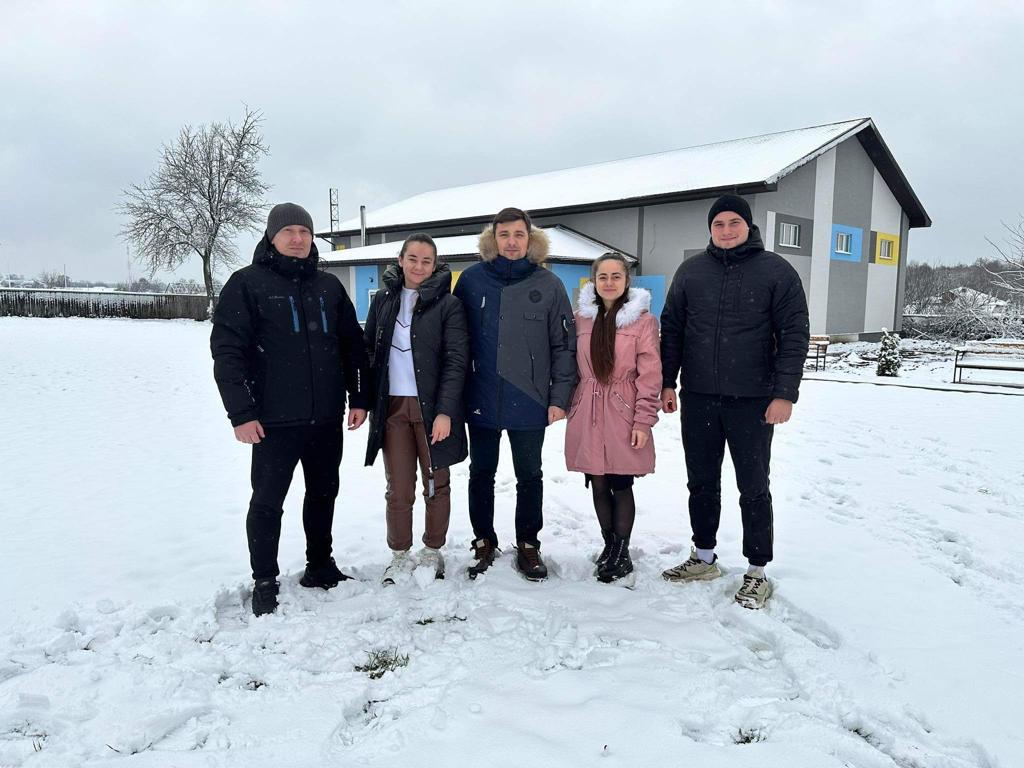 Some of the team standing in the first snow of the year