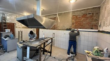 Workmen rennovating the bakery
