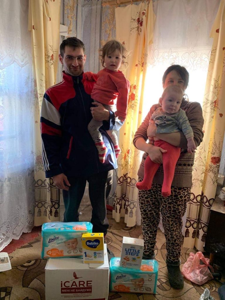 Family who live just outside Lebedyn city receiving aid.
