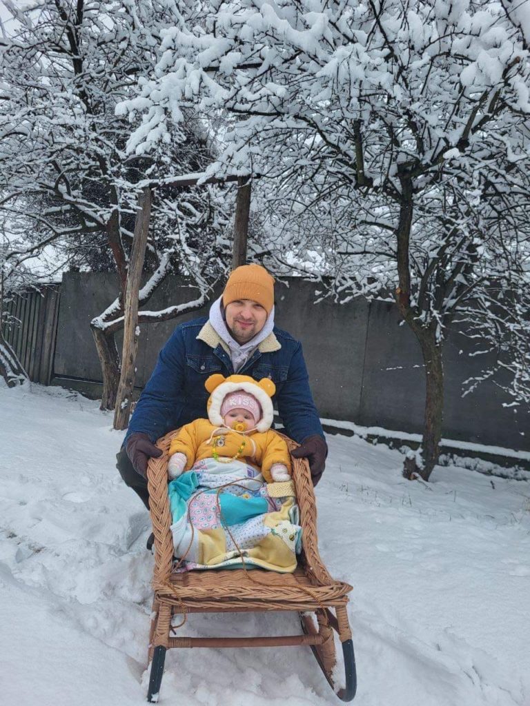 Bohdan and his daughter on their slegde