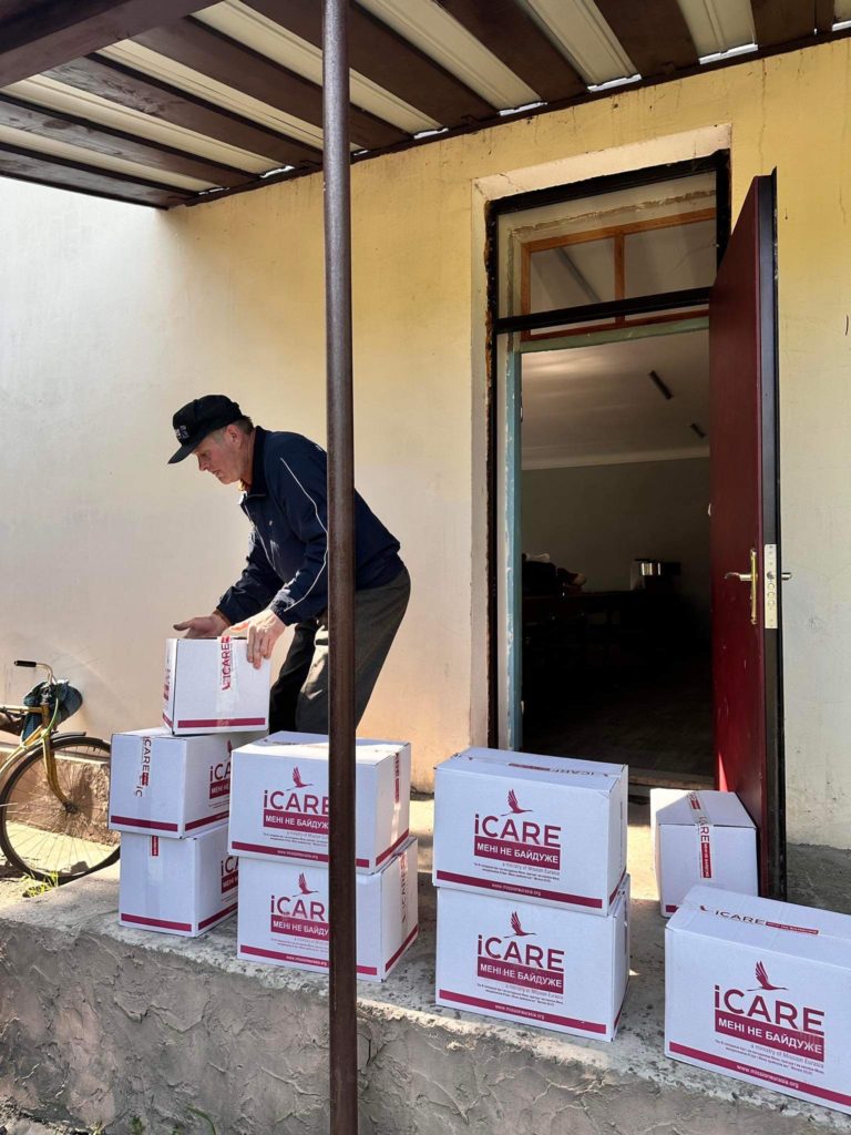 Aid packages being stacked outside ready to be loaded into the lorry