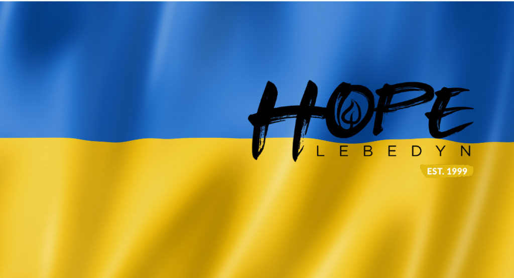 The Hope Lebedyn logo on a Ukranian flag