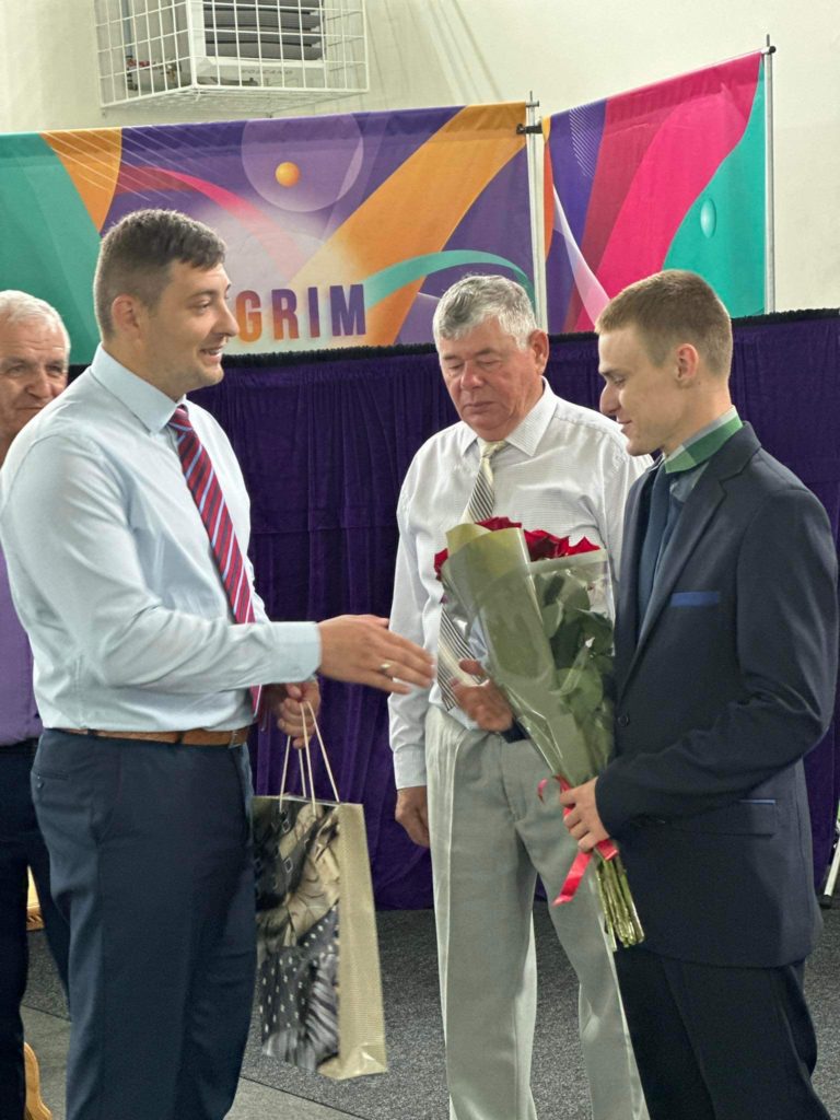 Famer Sergey being congratulated by Bohdan