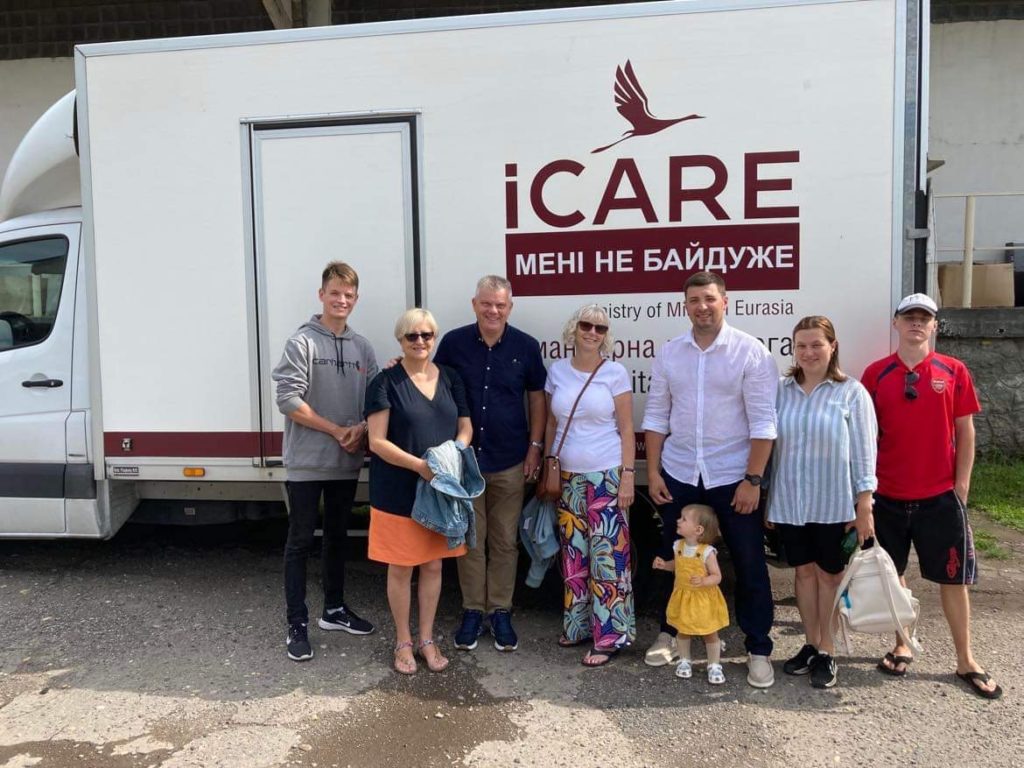 Peter, Karen, Sandra, Bohdan, Alla and Farmer Sergey standing in front of one of the iCare trucks