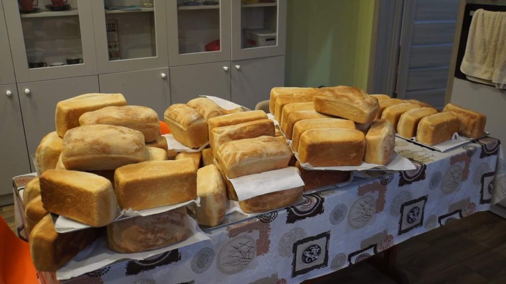 Freshly baked bread piled on a table at the Centre