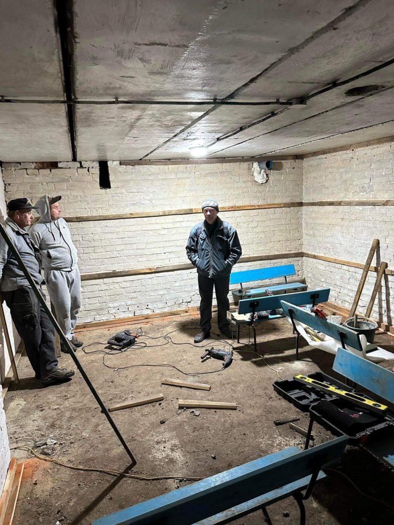The underground bomb shelter being refurbished that currently has bare walls, ceiling and floor