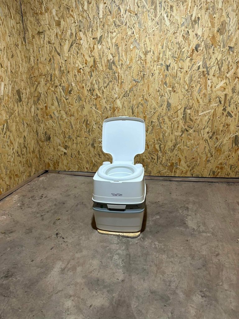 The chemical toilet ready to be installed in the new bomb shelter