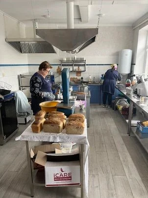 Luda at work in the bakery at the Centre