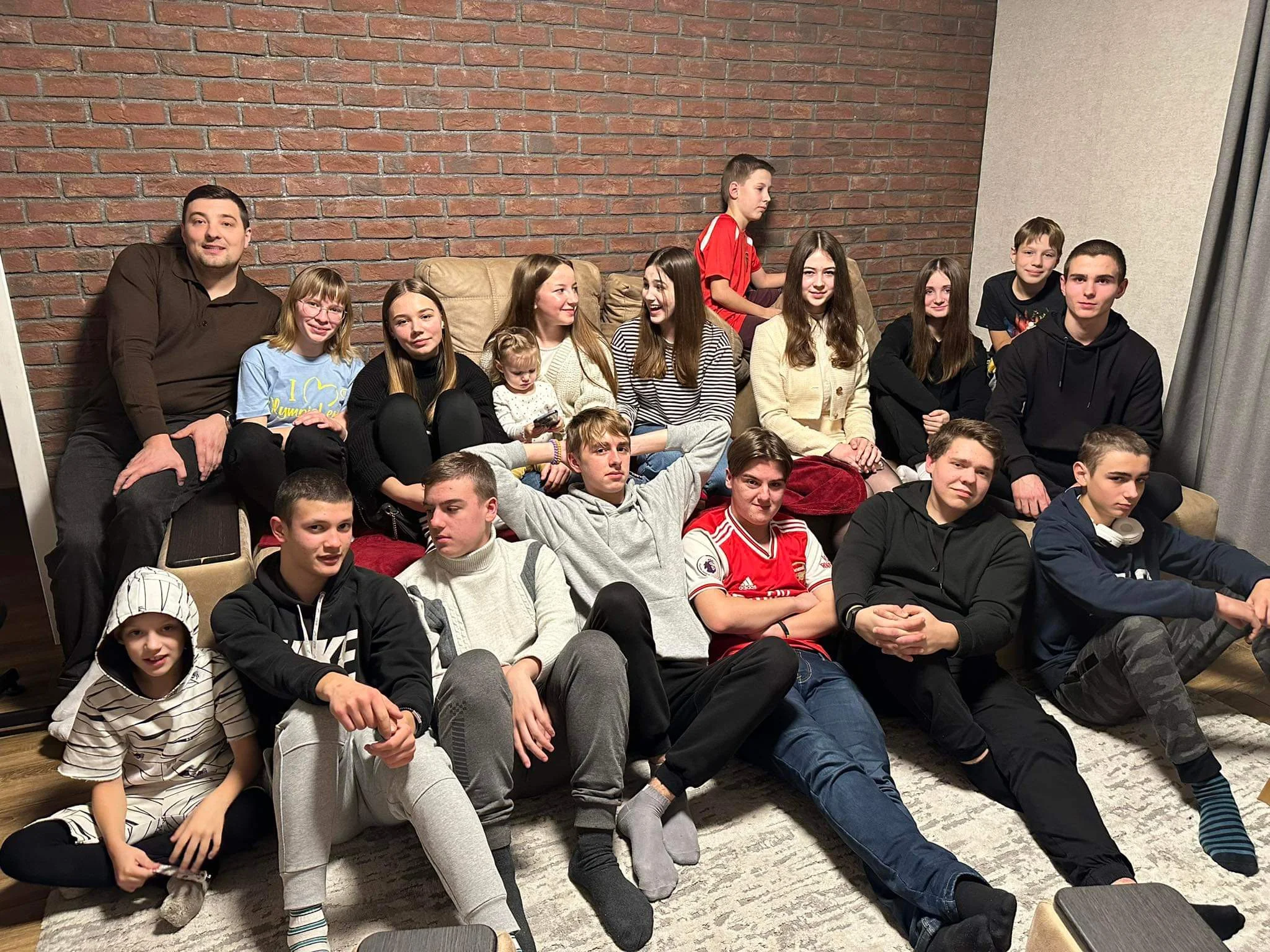 Bohdan and a some of the youth sitting in Bohdan's lounge at a youthgroup meeting