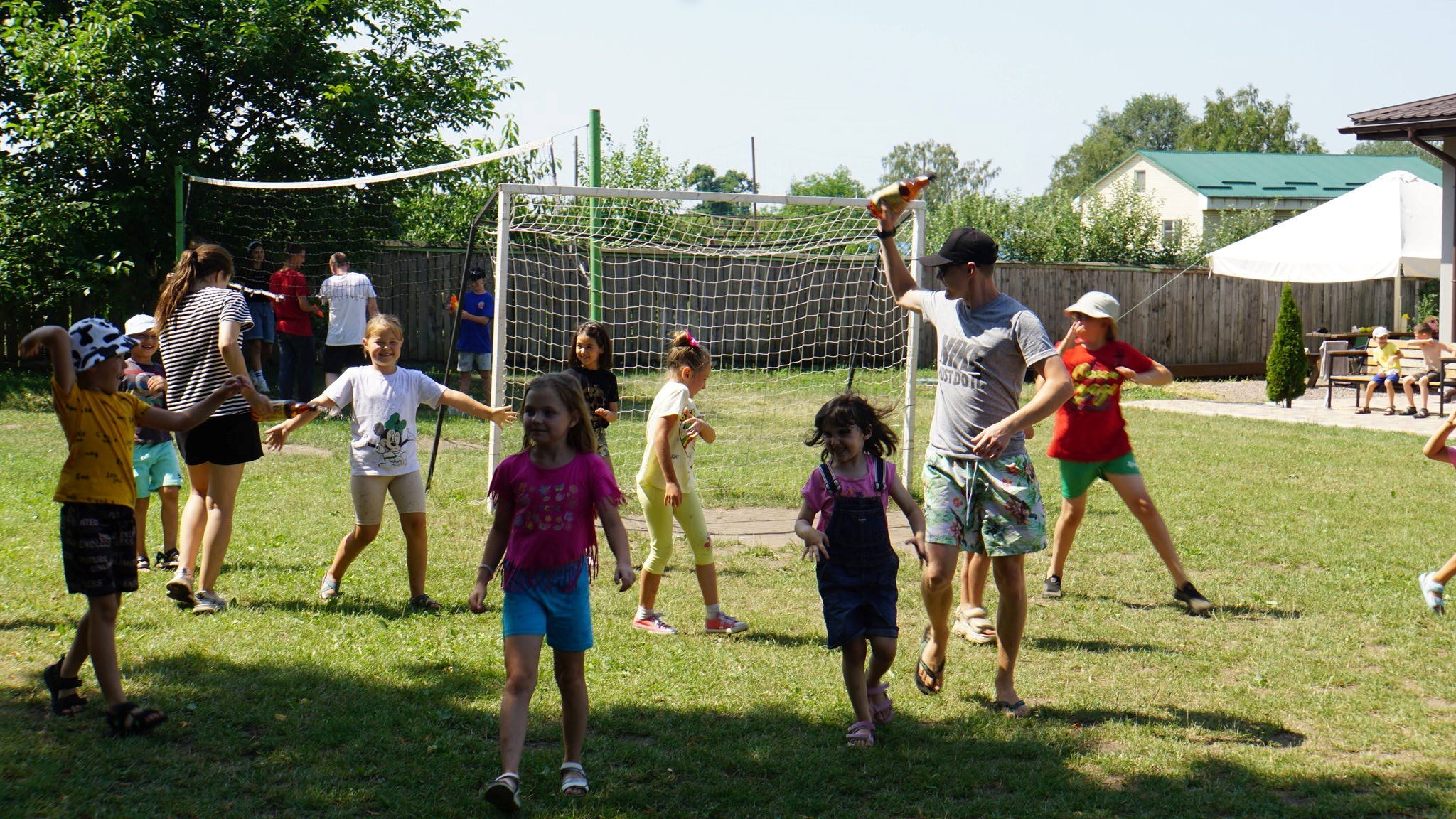 Children running around outside the Centre playing games