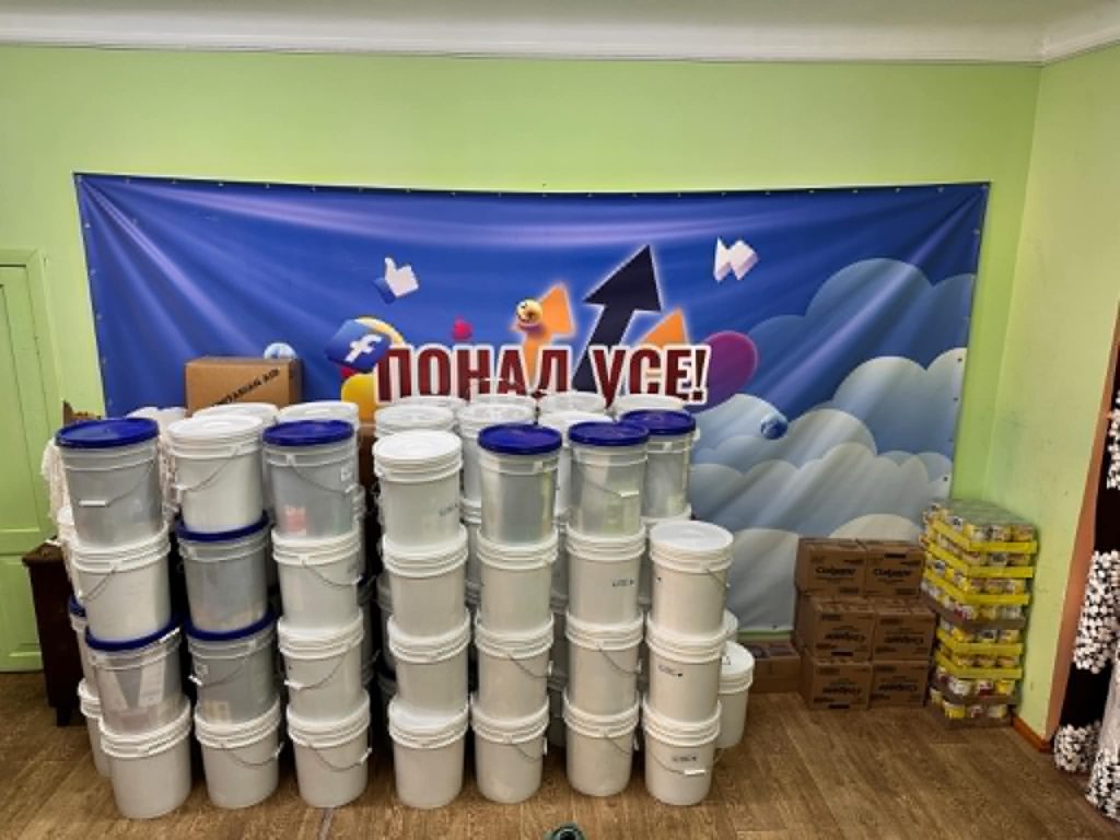 Buckets of aid piled up in stacks of four in the Centre