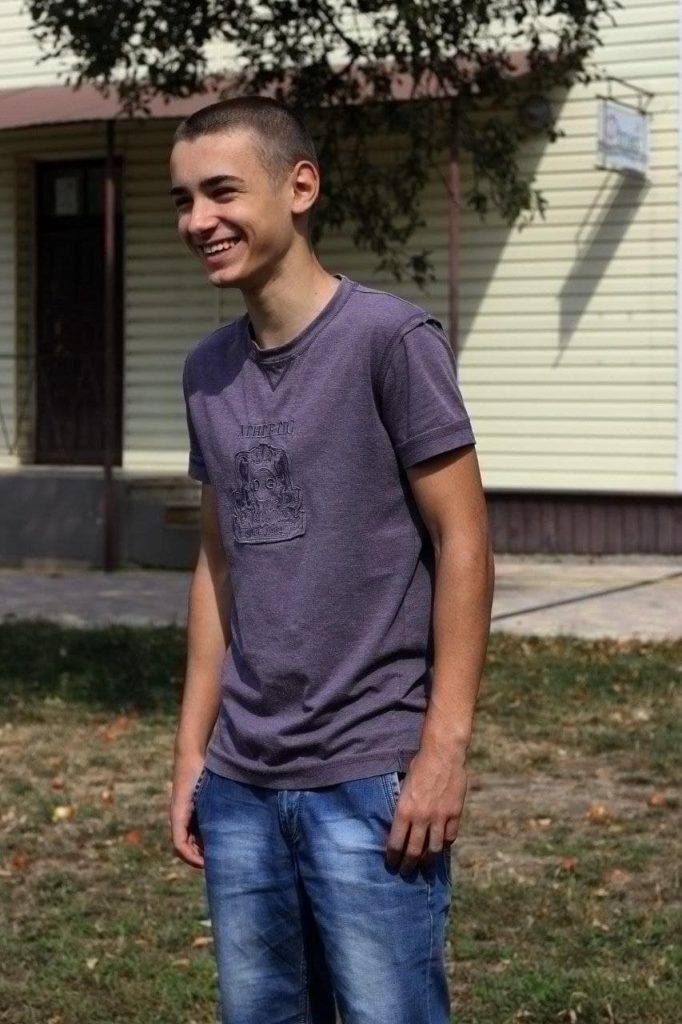 A photo of smiling Alexander who has become a Christian recently