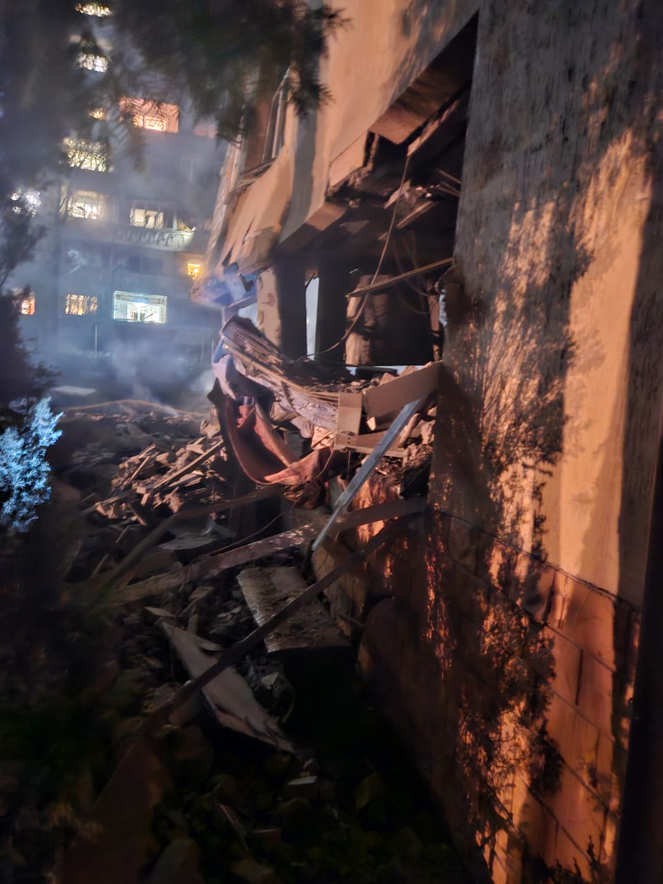 Aftermath of missile damage at Larissa's orphanage with blast damage to the ground floor and windows blown out