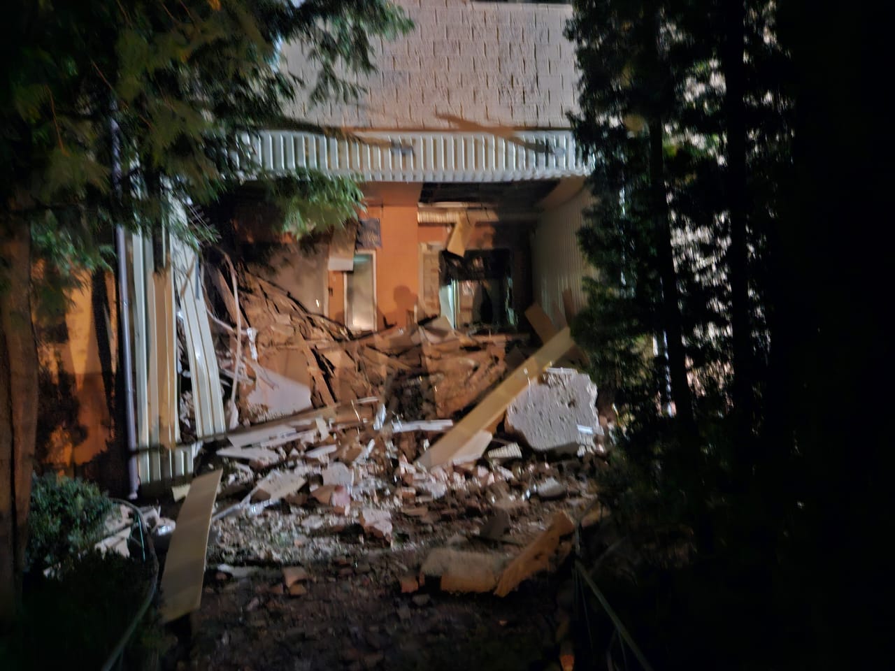 Aftermath of missile damage at Larissa's orphanage with blast damage to the ground floor shown