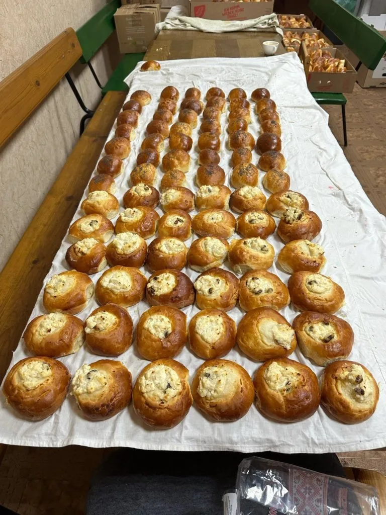 Rows of baked goods laid out on a large table