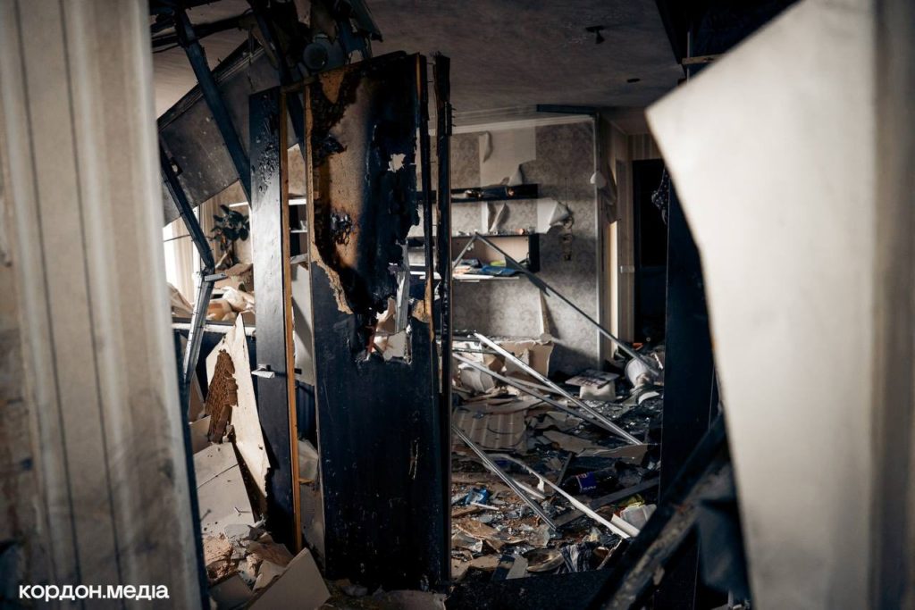 Interior of a bomb-damaged apartment in Okhtyrka showing severe destruction and debris.