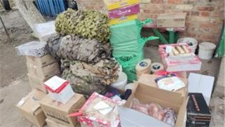 Boxes of humanitarian supplies prepared for soldiers.