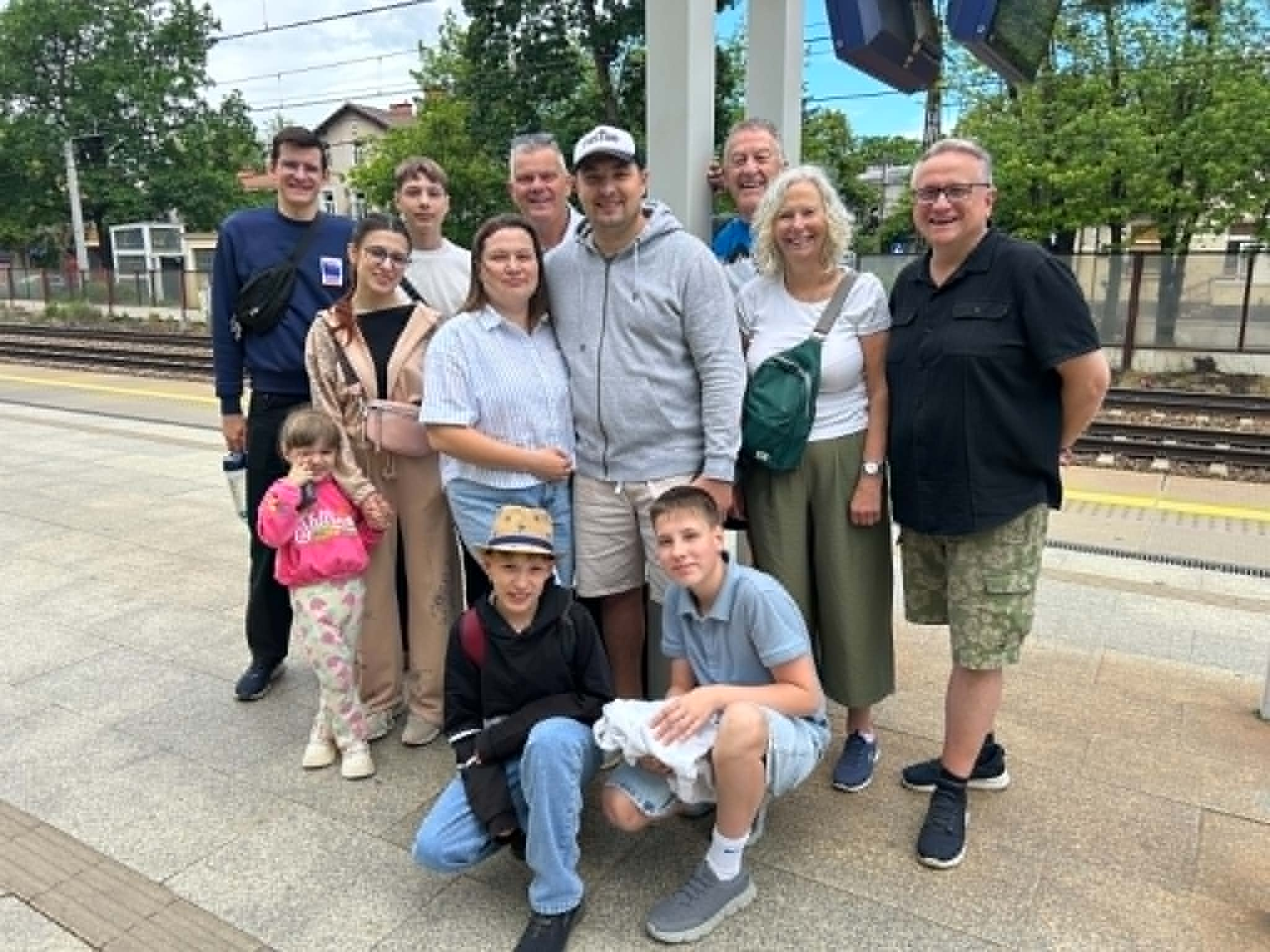 Group photo at a Polish railway station during the trustee visit to see Bohdan, Alla and family.