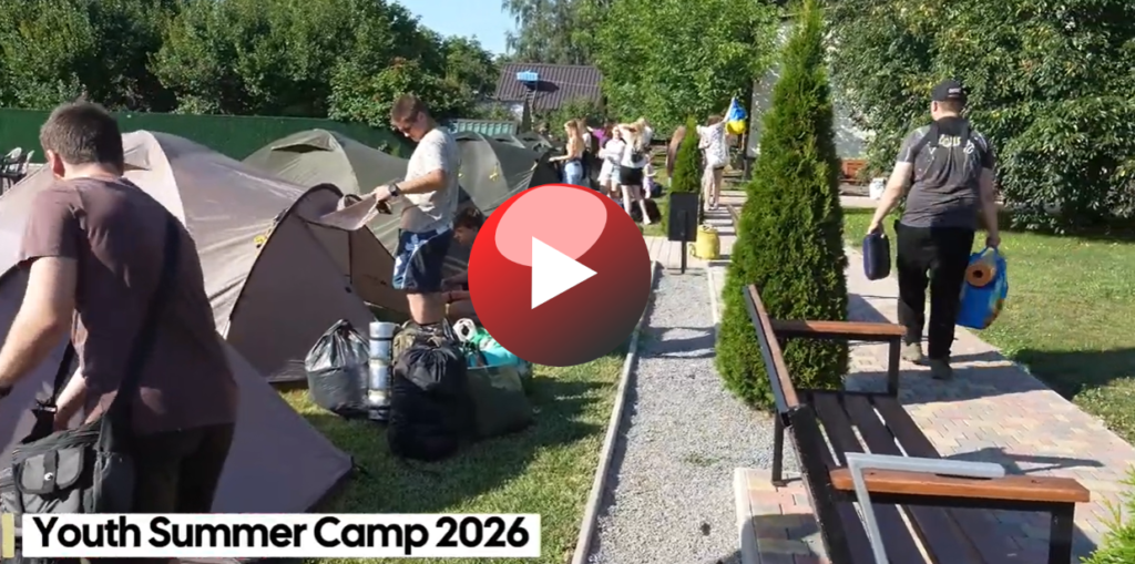 Teenagers and leaders setting up tents at the Mission Centre in Lebedyn for the 2026 summer youth camp.