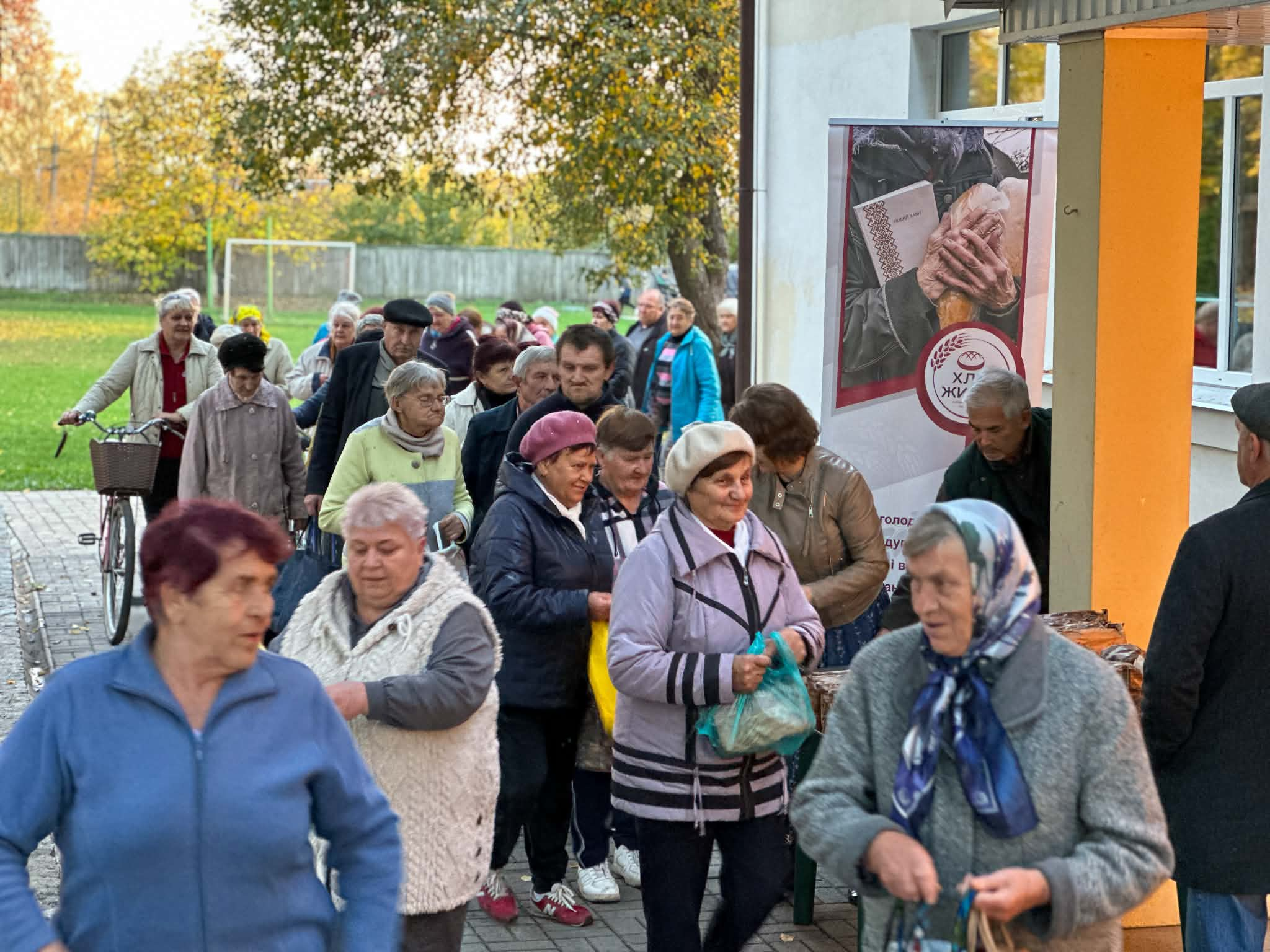 Elderly Lebedyn residents queue outside the Centre  to receive bread baked on the premises.